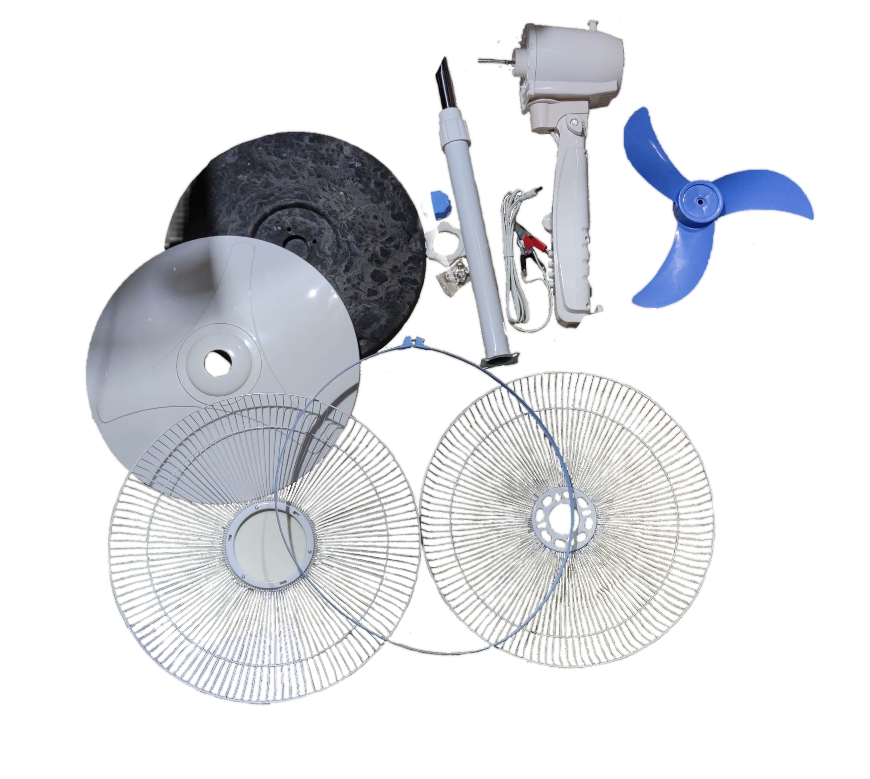Disassembled 16 inch 12V DC stand fan parts including blades, motor, and protective grills from China