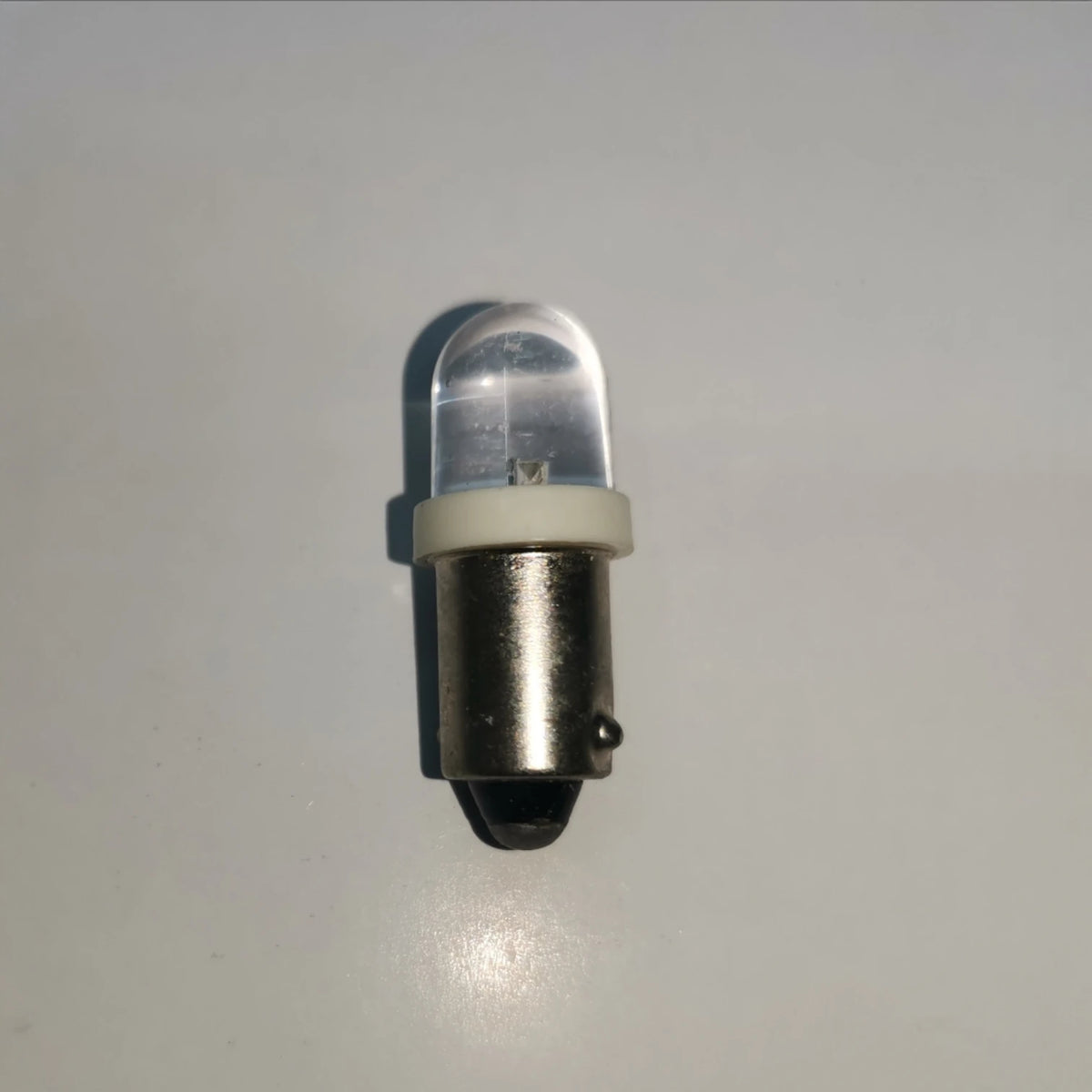 Denko 1W LED B9 pilot light indicator bulb with a clear lens and metal base