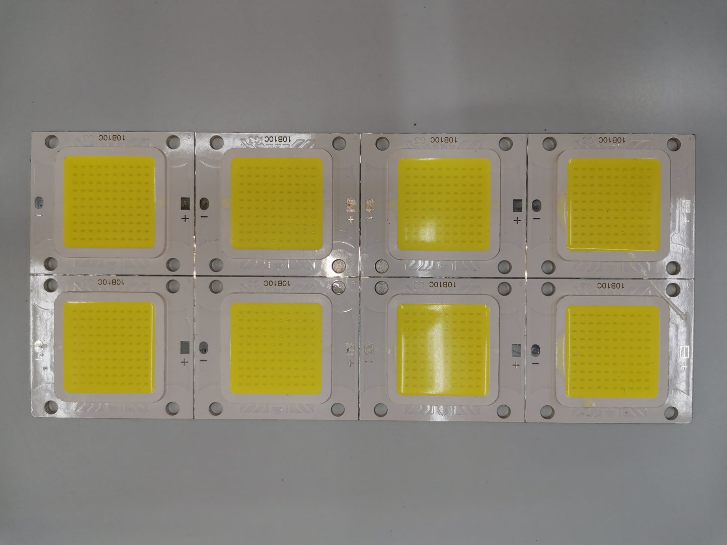 Set of eight 20W high power LED chip modules arranged on a metal board for LED bulbs and strips