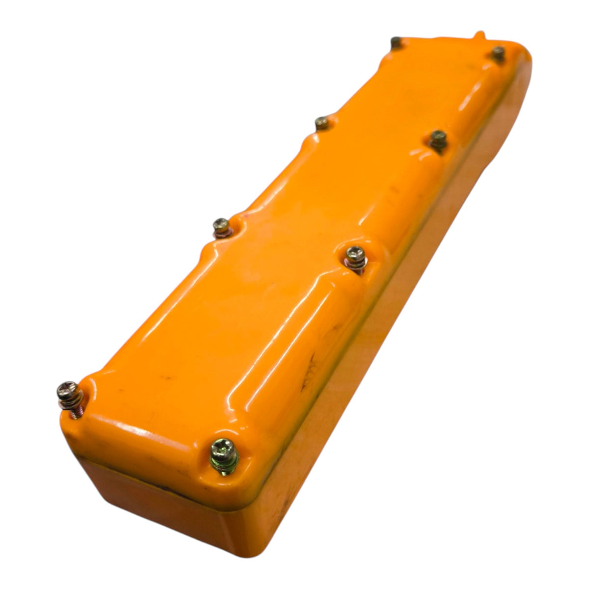 An orange metal engine valve cover with six visible silver bolts, shown on a plain white background.