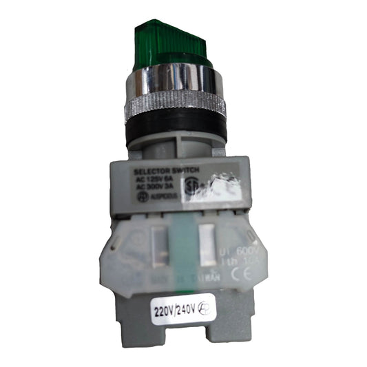 A small industrial electrical switch component with a green translucent top, silver metal band, black ring, and gray plastic base, photographed on a plain white background.