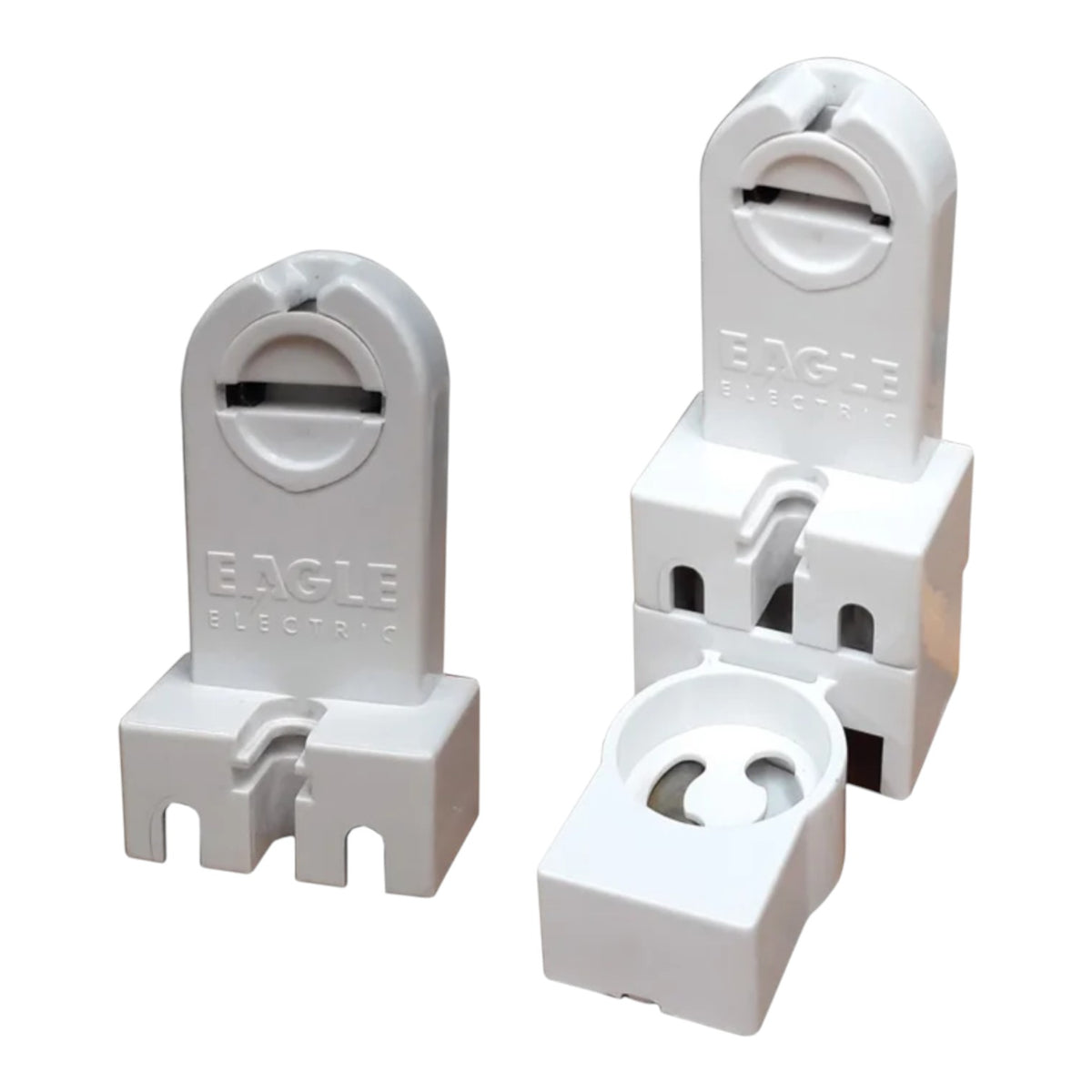 Three white plastic terminal blocks with the brand name EAGLE ELECTRIC embossed on them, shown against a plain white background.