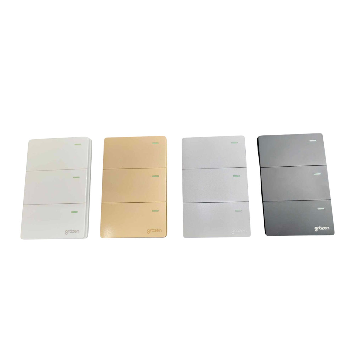 Four slim rectangular wall switch panels shown side by side on a plain white background, in white, champagne gold, light gray, and dark gray finishes. The brand name 'grtman' is visible near the bottom of each panel.