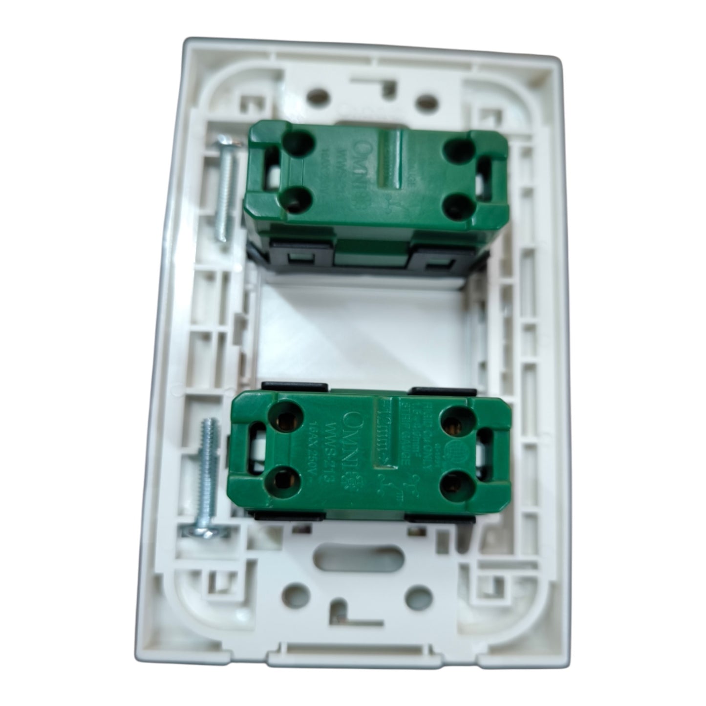 A white plastic double switch socket backplate containing two green screw terminal blocks with mounting screws, shown on a plain white background.