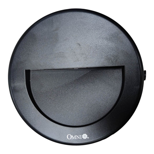 A top-down view of a black circular robotic vacuum cleaner lid, featuring a central semi-circular cutout and the 'OMNI+' brand logo printed in white at the bottom.