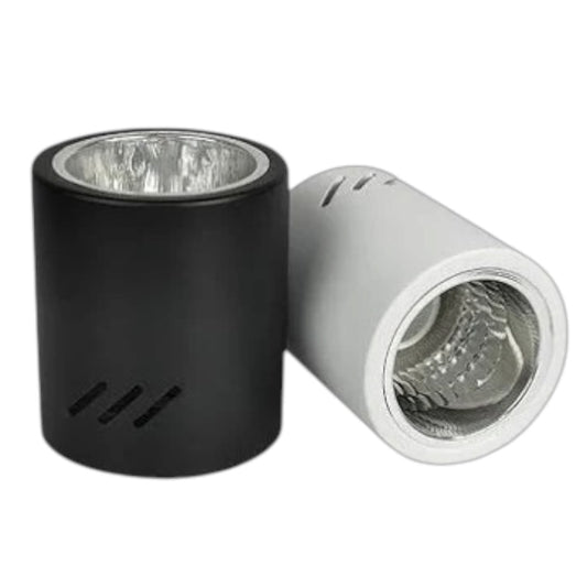 Two cylindrical light reflector or lamp housing components on a plain white background, one matte black and one metallic silver.
