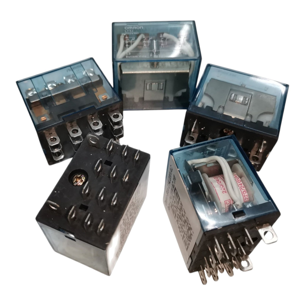 Five electrical contact relays with translucent blue-gray plastic housings and metal terminals, shown on a plain white background.