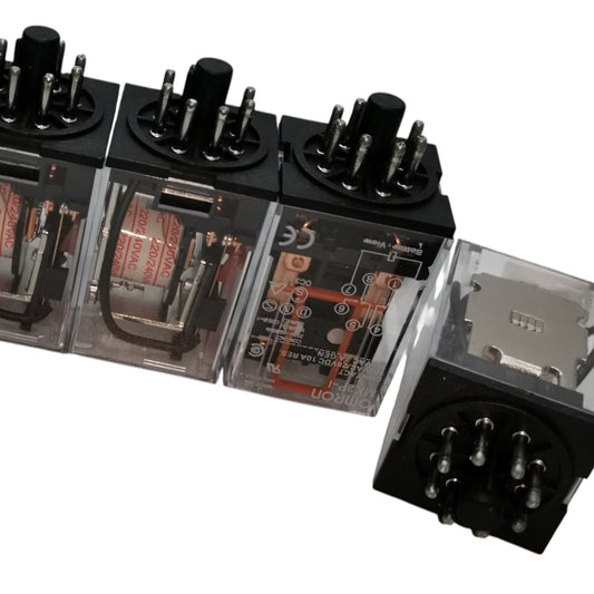 A row of industrial electrical relays with black plastic housings, clear transparent side panels showing internal contacts and coils, and multiple metal terminal posts, photographed on a white background.