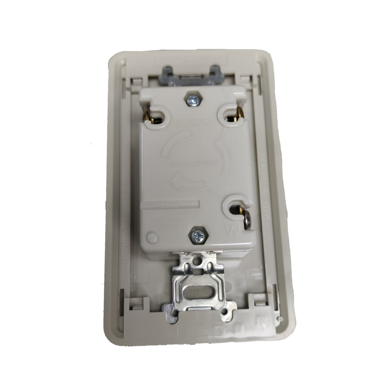 An off-white plastic rear view of a wall switch plate or socket cover with metal screw terminals and a latch mechanism, isolated on a white background.