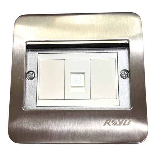 A modern brushed stainless steel double light switch plate with a white double-gang switch in the center, featuring a recessed socket on the left side and the RAVO brand logo on the bottom right.