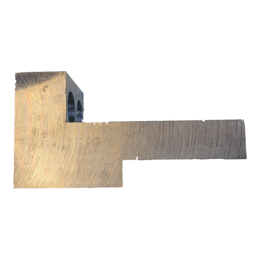 Metal component with a worn surface on a white background
