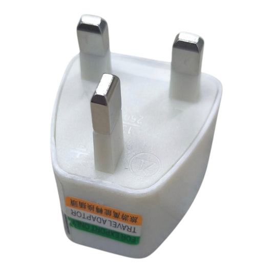 A white plastic UK travel adapter plug with three metal pins, featuring a small orange and green label on the front.