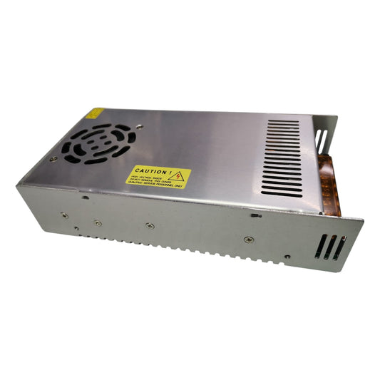 Metal power supply unit with a warning label on a white background