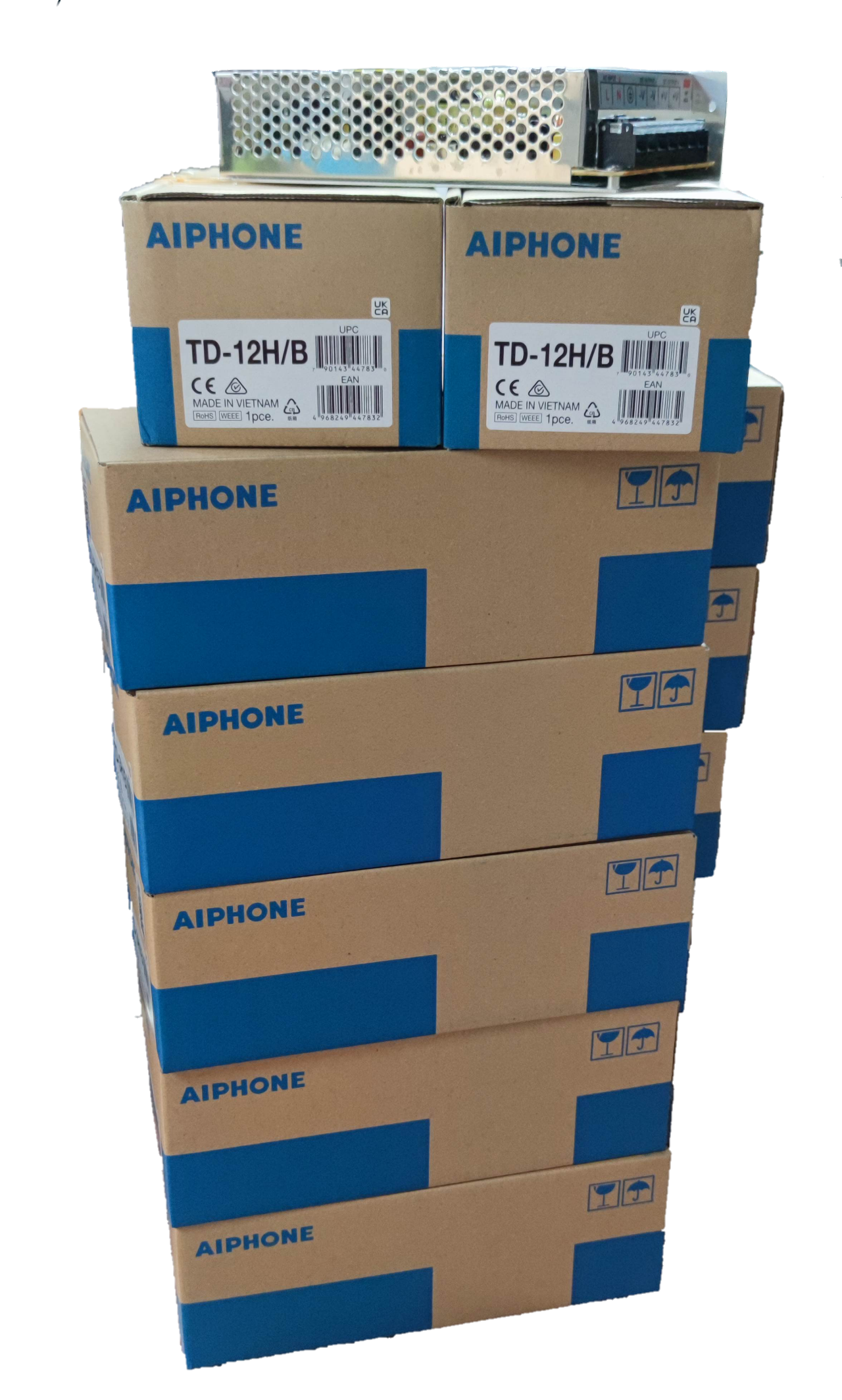 Stack of Aiphone 12 station intercom system boxes with security system equipment on top