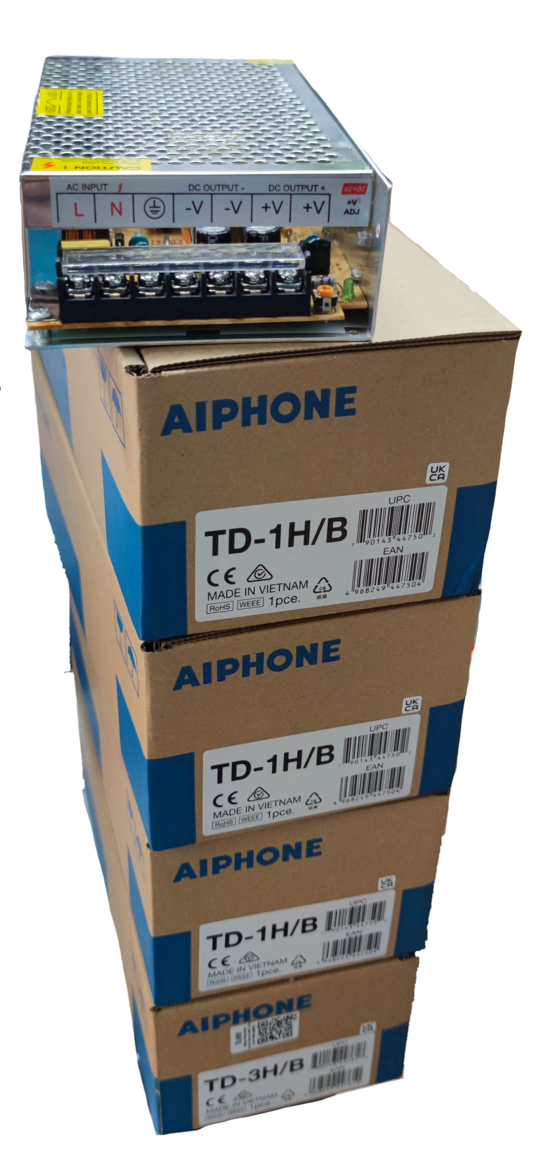 Aiphone 3 station intercom system power supply units stacked in packaging boxes for CCTV and security