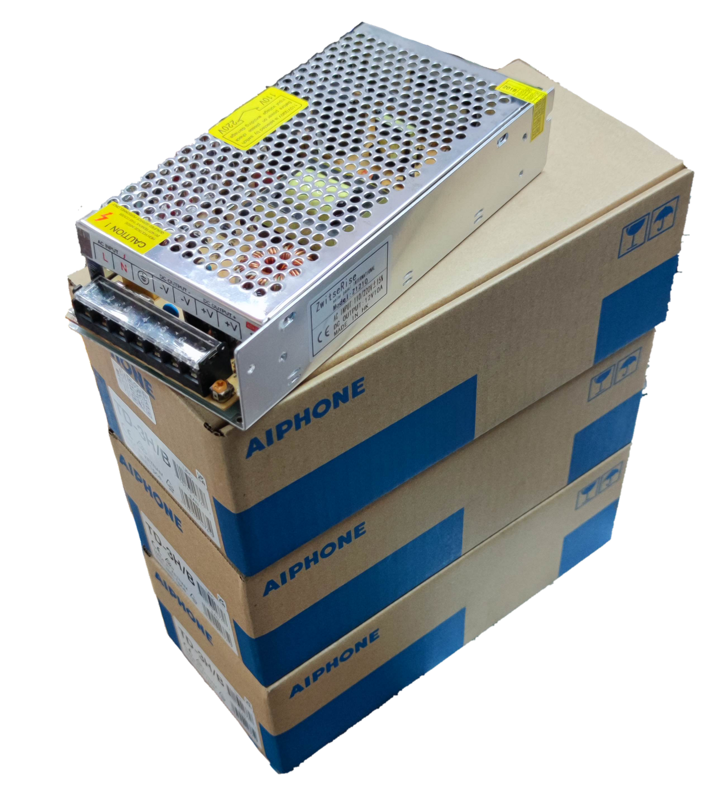 Aiphone intercom system power supply unit on stacked Aiphone branded boxes for CCTV and security system