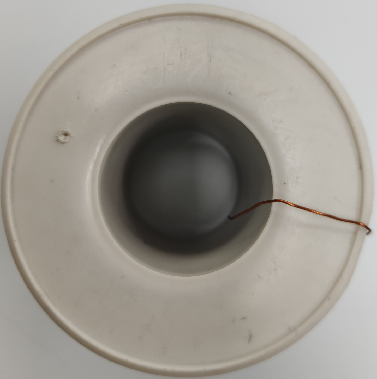 Philflex AWG 43 magnet wire spool with thin copper wire neatly wound on a white plastic reel