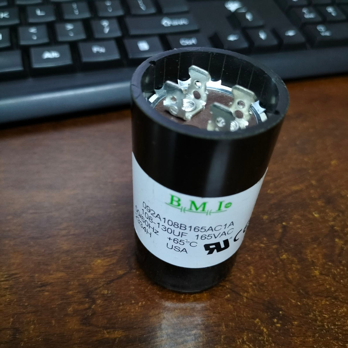 BMI 108-130mfd capacitor 165v with metal terminals and black casing for electrical applications