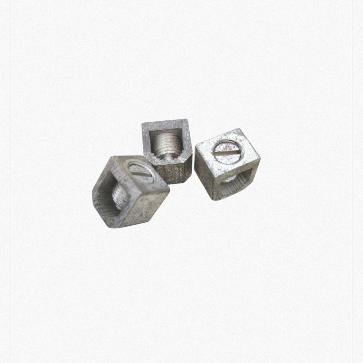 Three metal circuit breaker bolt on lugs used for electrical circuitry and parts by GE and Koten