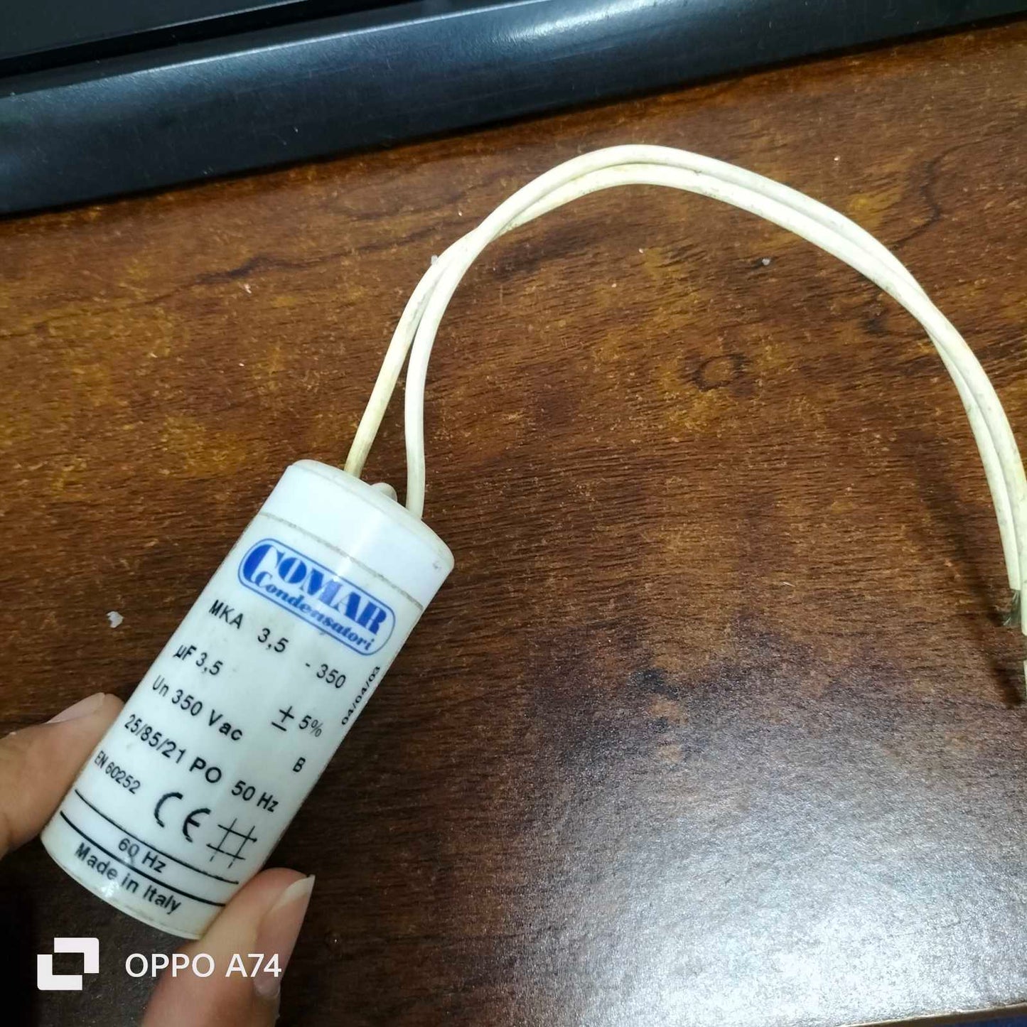 Commar 3.5uF motor run capacitor with attached white wires for electrical circuitry use
