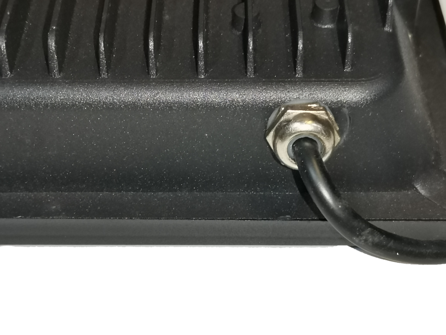 Close-up of DENKO 30W 220V outdoor LED light black power cable connection showing heat sink fins