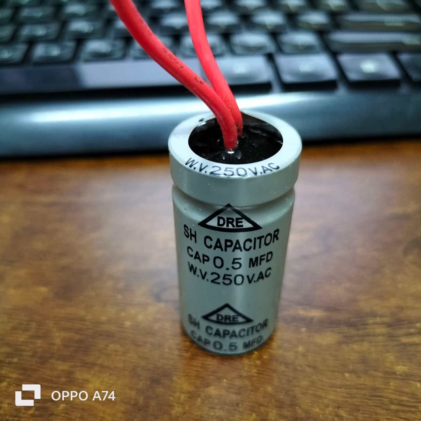 DRE 0.5MFD Motor Running Capacitor with 250V AC rating and red wires for electrical circuitry
