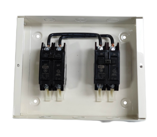 GE and Koten 100A manual transfer switch with black circuit breakers in a white metal enclosure