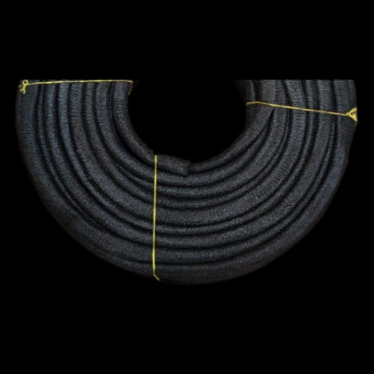 Coiled black mica electrical insulation tubing braided protective sleeve tied with yellow twine for wiring