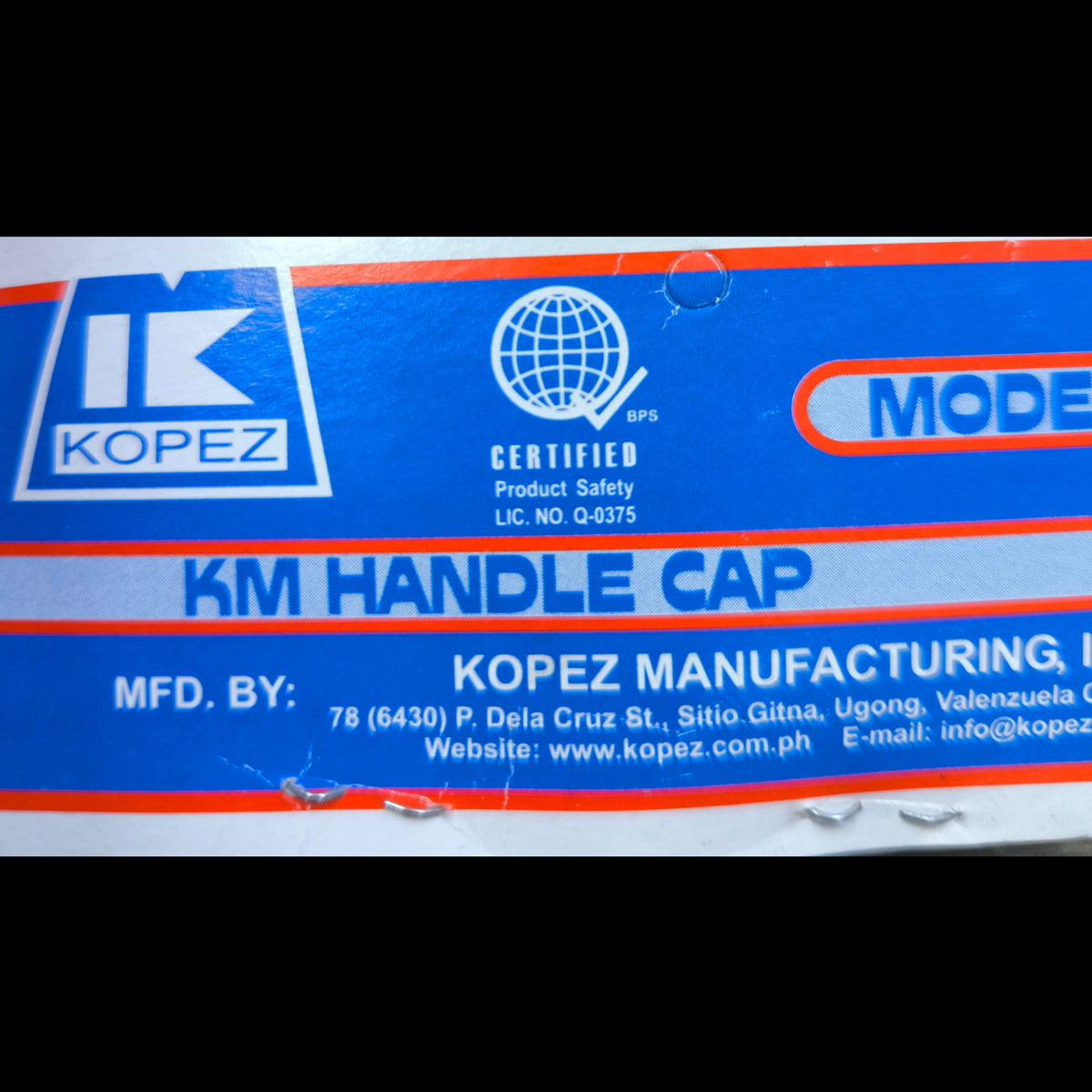 Kopez 2A 220V electrical plug packaging label showing product safety certification and manufacturer details