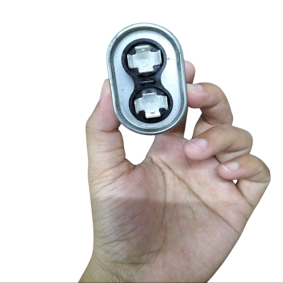 Mallory 3UF 440V oil-filled capacitor held in hand for easy viewing and installation
