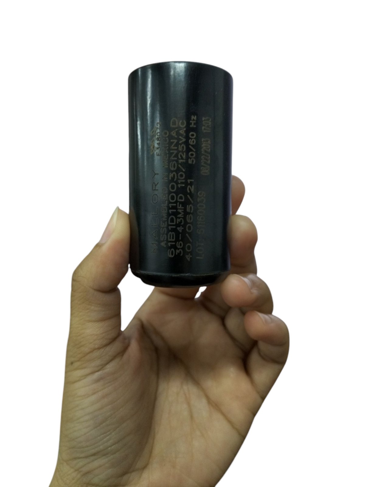 Mallory motor capacitor showing black cylindrical electrical circuitry part