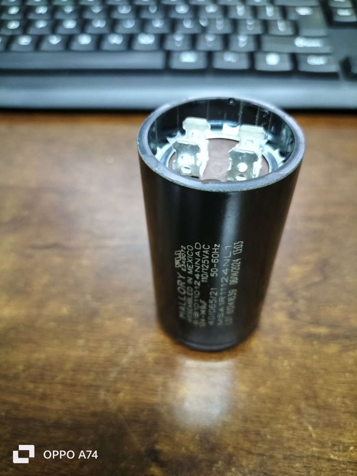Mallory black cylindrical motor capacitor with metal terminals
