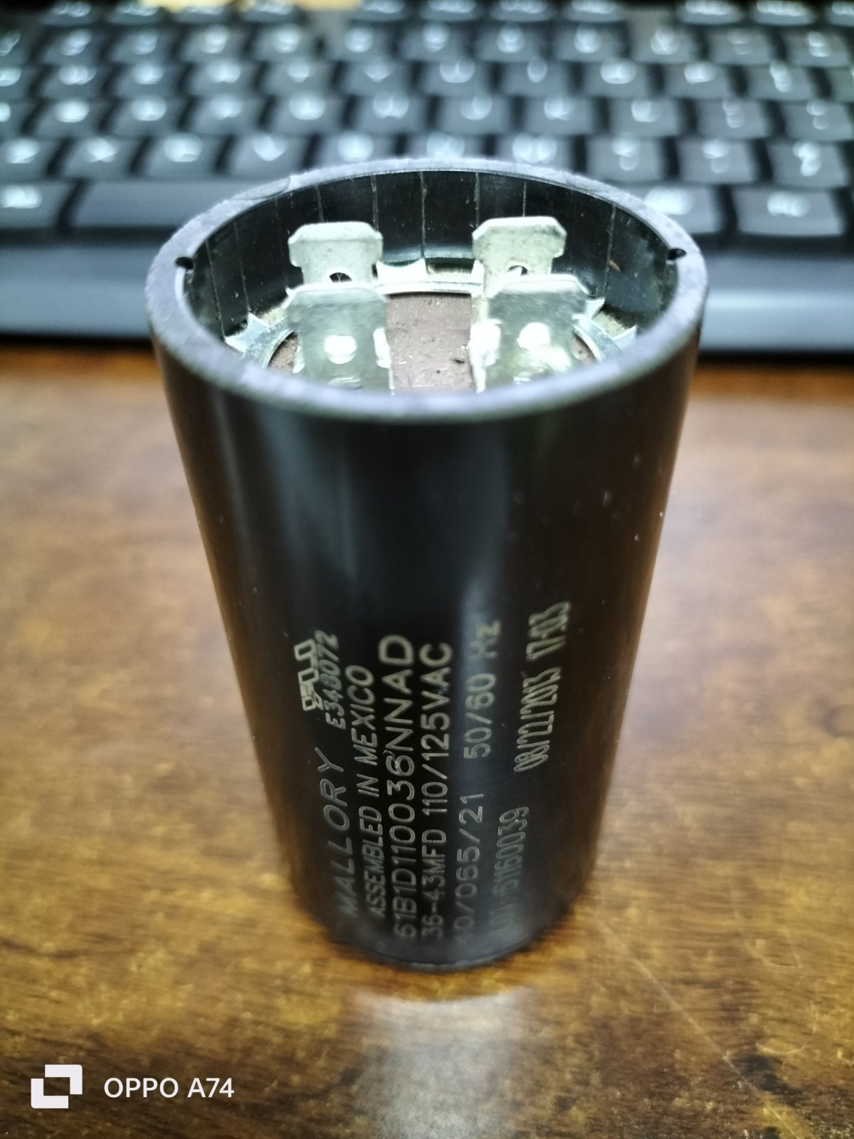 Mallory motor capacitor black cylindrical electrical part with metal terminals