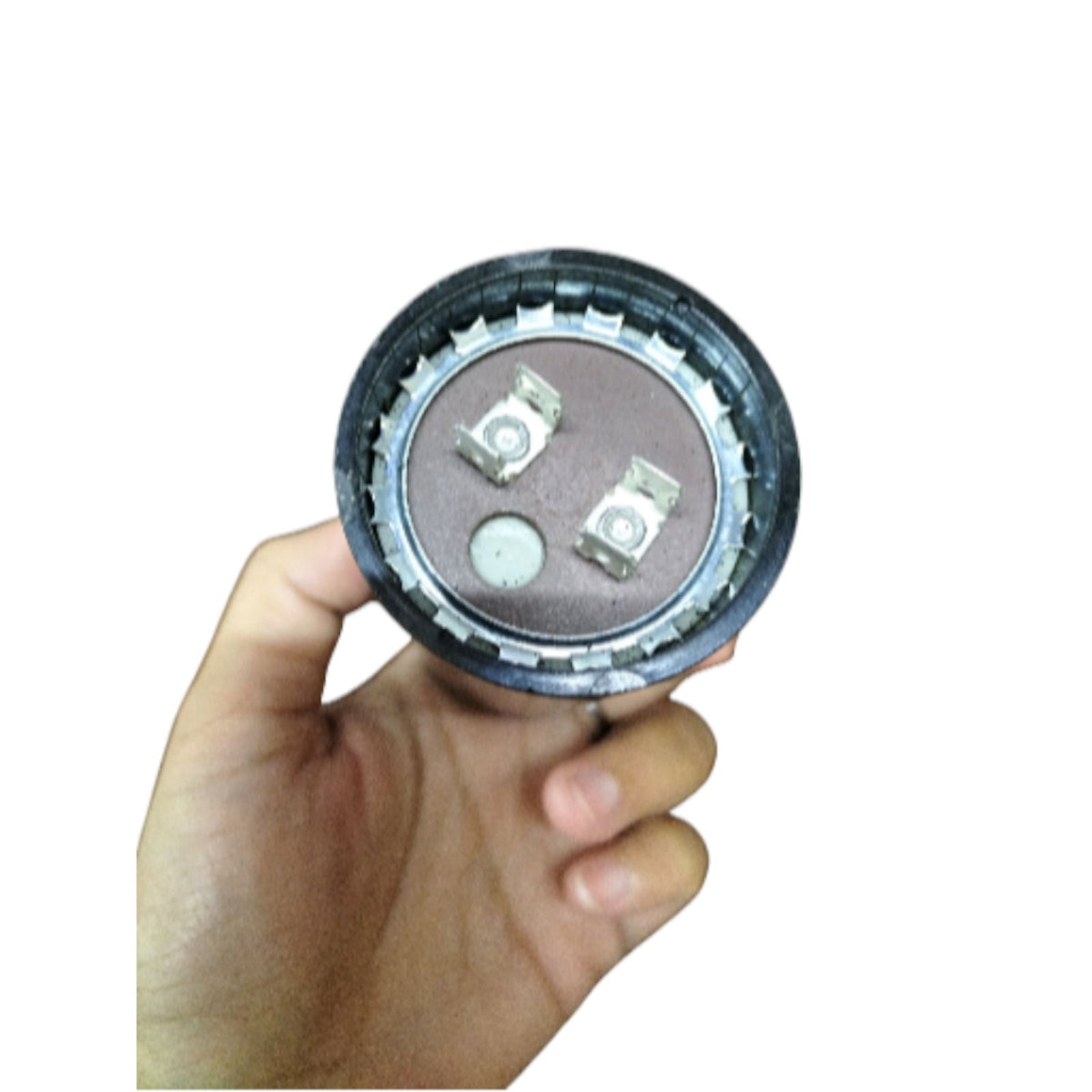 Mallory motor starting capacitor 850-1020UF 125V held in hand showing terminal connections