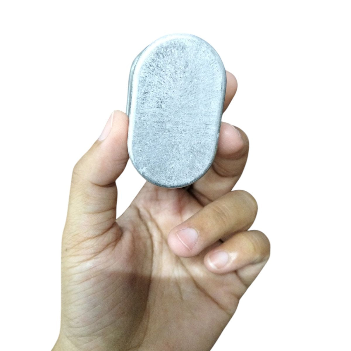 Mallory oil-filled running capacitor 440V AC held in hand, compact metal design for efficient performance