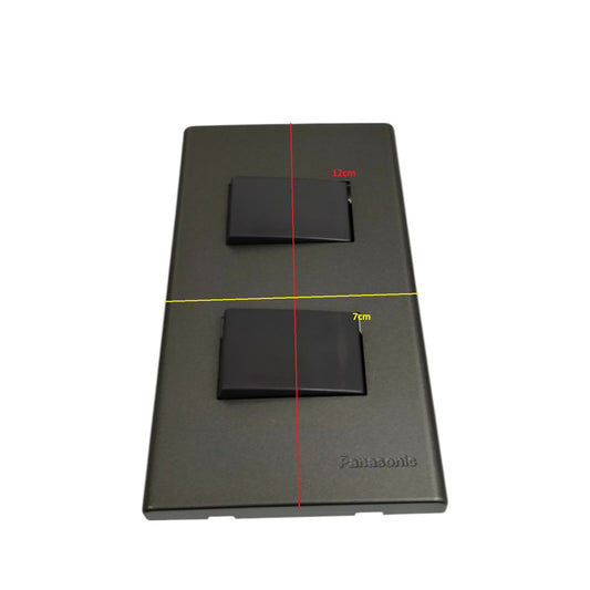 Panasonic 2 gang 4 way switch with black rocker buttons on a gray plate for power control