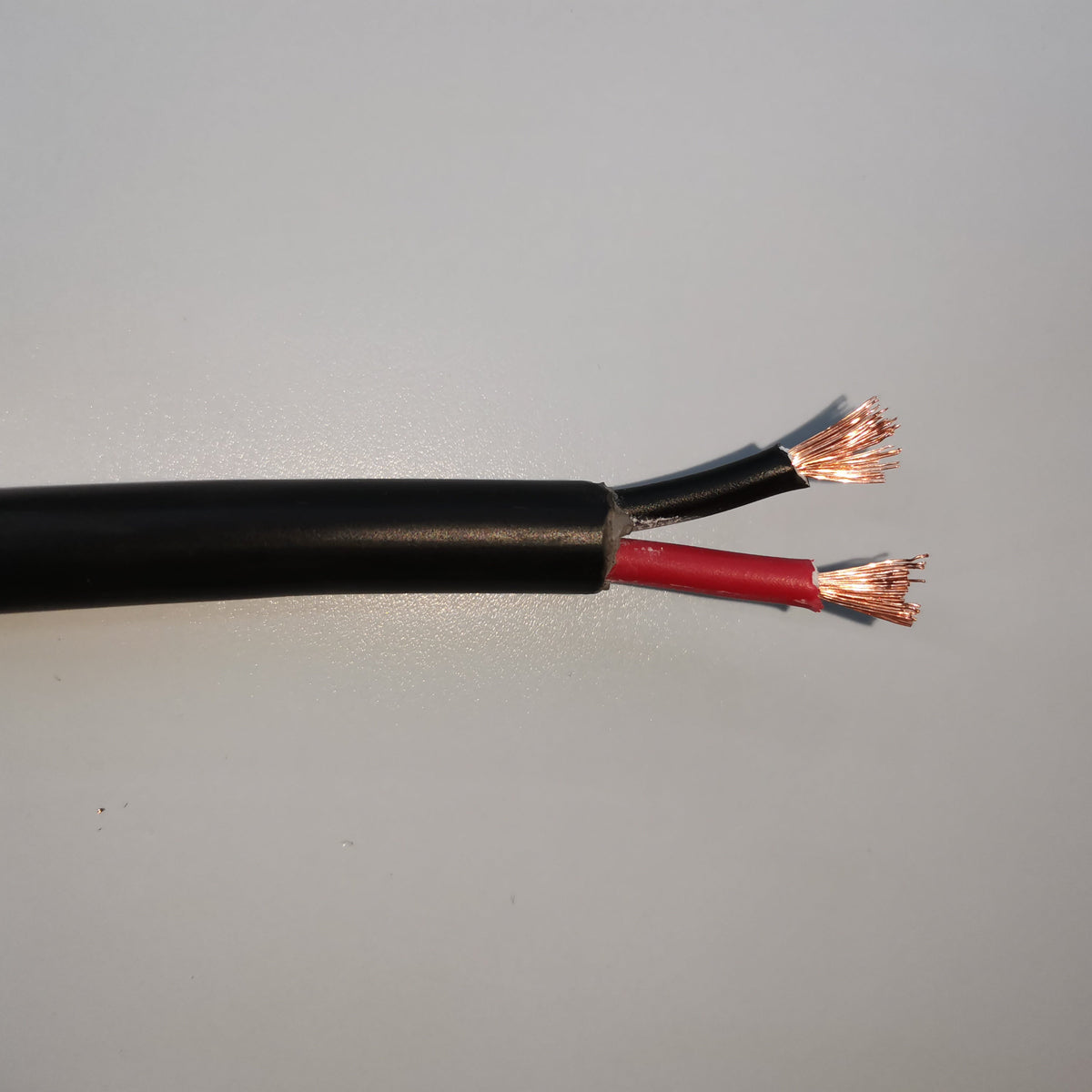 Close-up of Phelps Dodge perma cord wire with black and red insulated copper leads