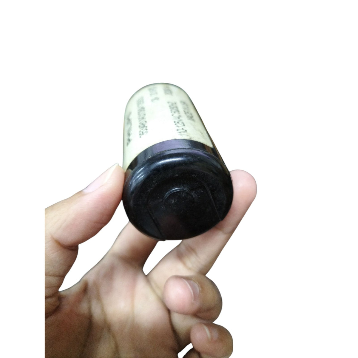 Philips Starting Capacitor 108-130 MFD held in hand, ideal for electrical circuitry applications