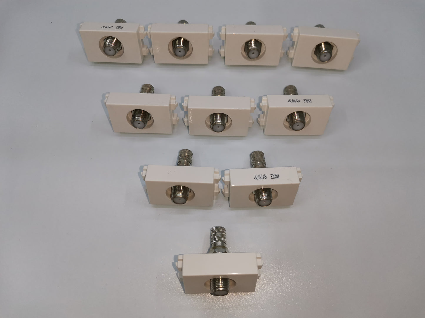 Royu cable TV outlet white connectors arranged in rows for electrical circuitry and parts