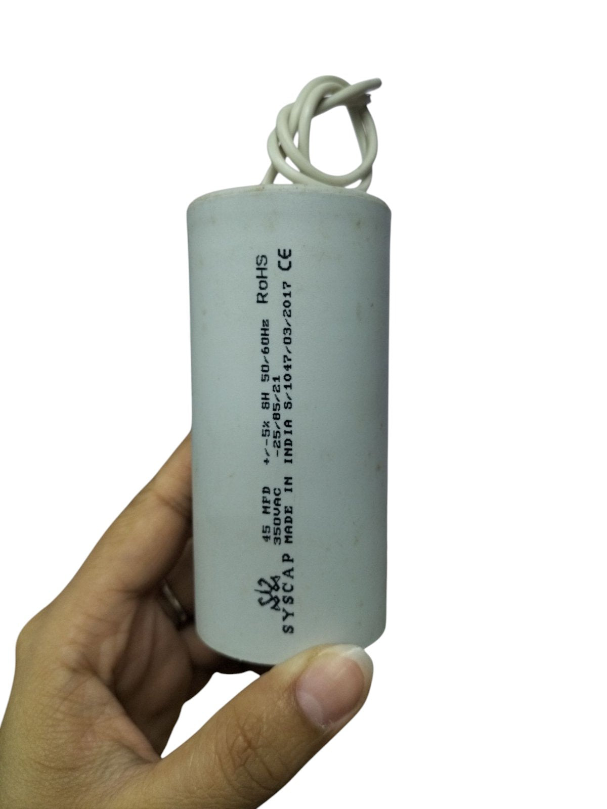 Syscap 45MFD 350V AC Running Capacitor electrical component held in hand