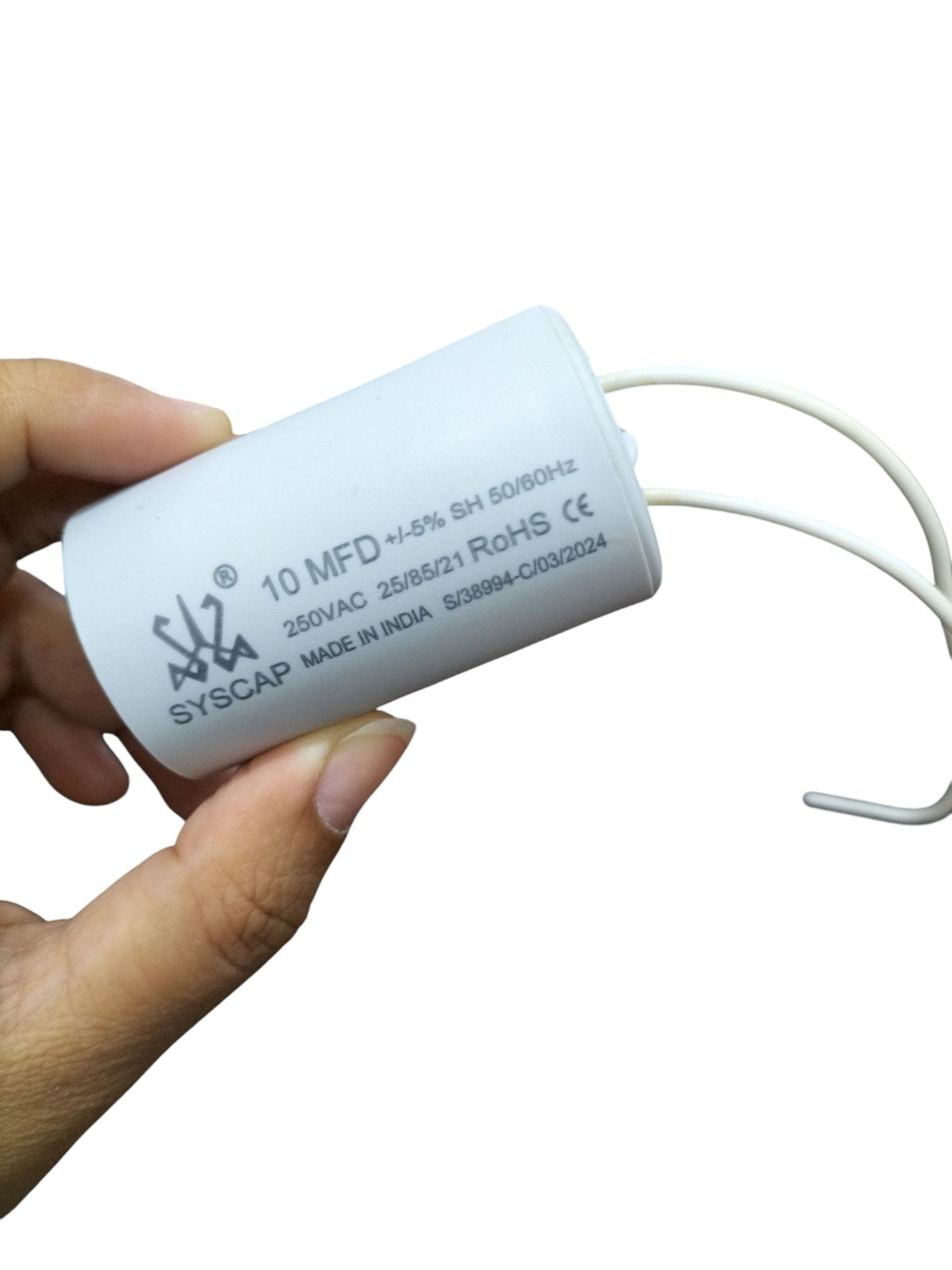 CBB 10MFD motor running capacitor white electrical component with wires held in hand