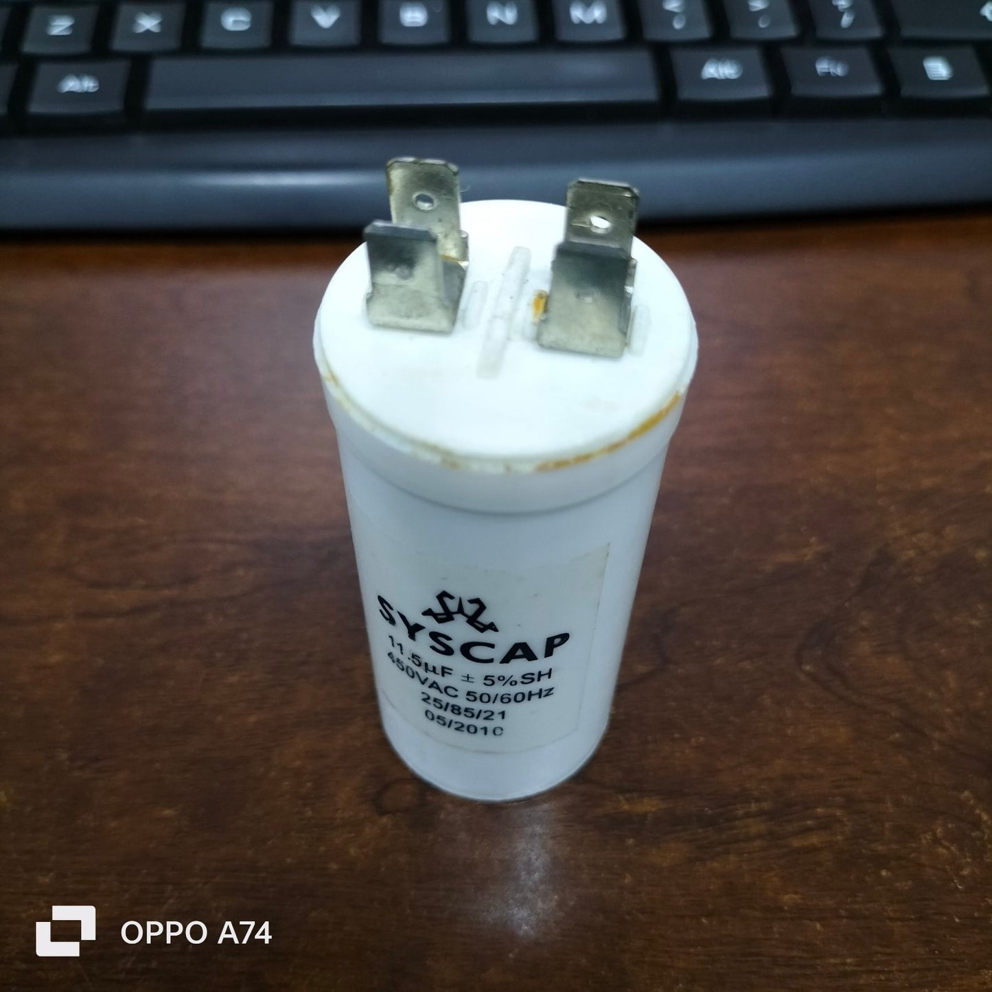 Syscap 11.5MFD 450 VAC Running Capacitor white cylindrical electrical part with three metal terminals