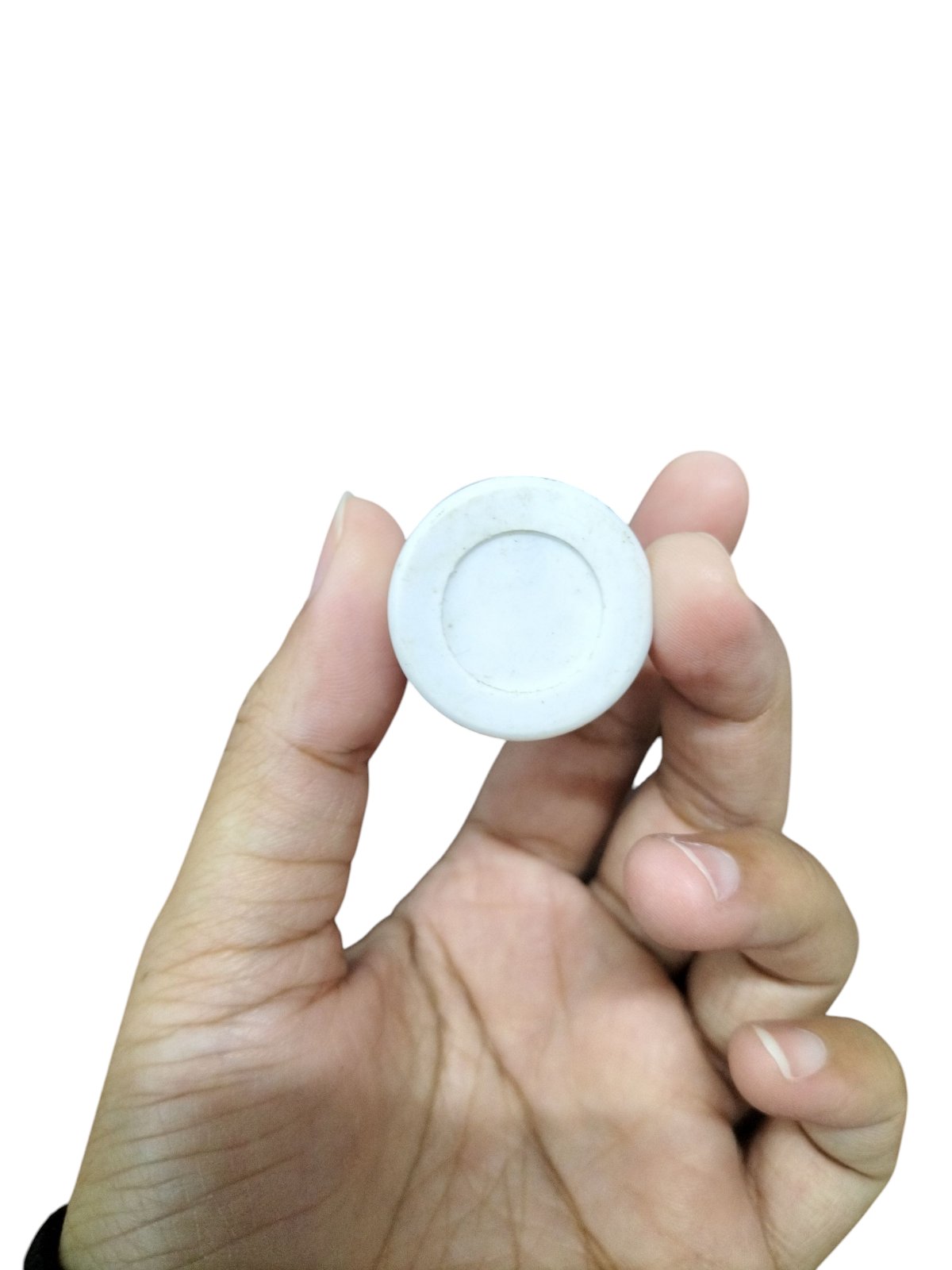 Hand holding Syscap 3.75uF 250V AC capacitor for electrical circuitry applications