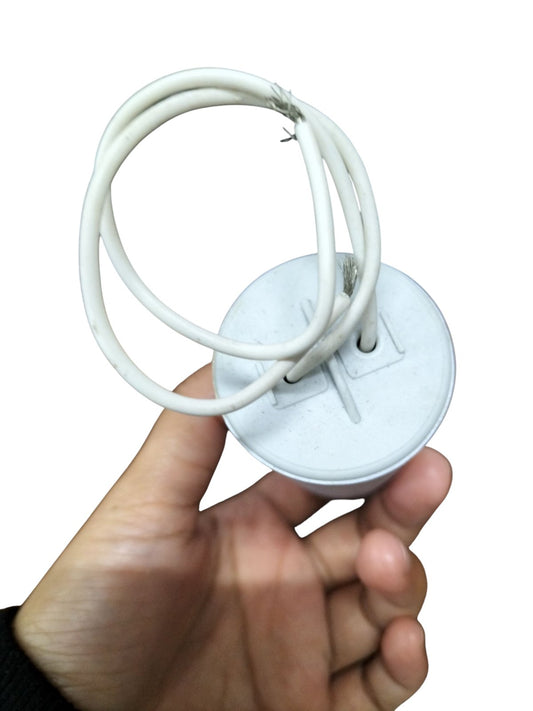 Syscap 45MFD 350V AC Running Capacitor in hand, ideal for electrical applications