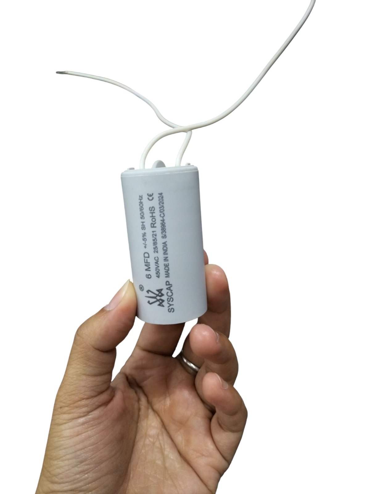 Syscap 6MFD Motor Running Capacitor white cylindrical electrical component held in hand