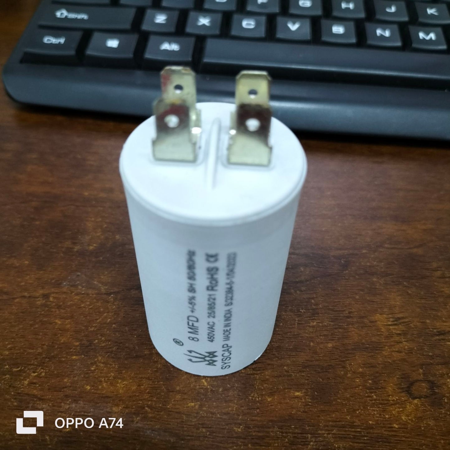Syscap 8MFD 450 VAC Motor Capacitor white cylindrical electrical component with metal terminals