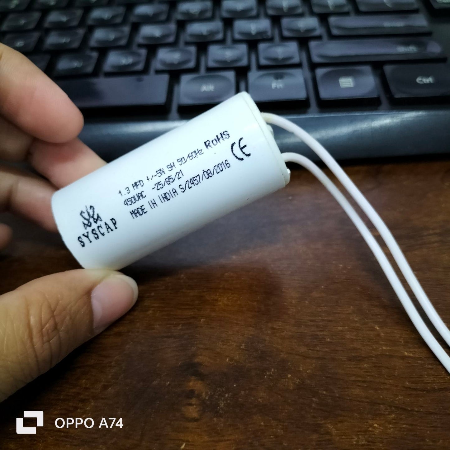 Syscap motor running capacitor 1.3mfd white cylindrical electrical component with wire leads