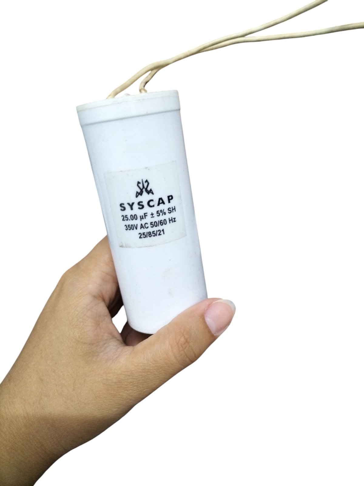 Syscap Running Capacitor 25MFD 350 VAC held in hand for electrical circuitry and parts