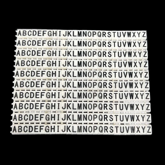 Grippes alphabet cable markers 260pcs white plastic A to Z letter clips on black background for wire labeling