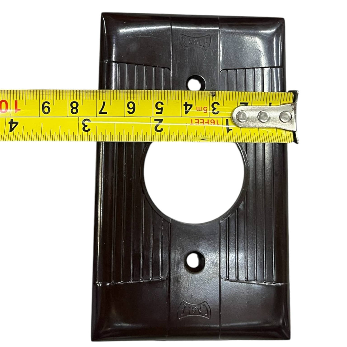 Eagle 1 Gang Round Plate Cover 35mm Brown with measuring tape showing dimensions for power points switches and plugs